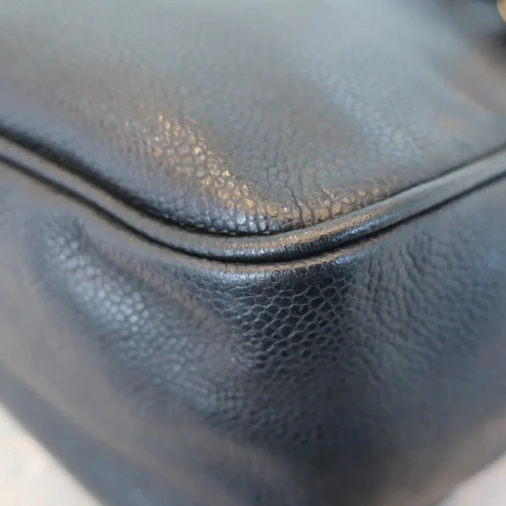 Authentic CHANEL black caviar leather backpack